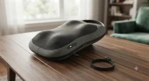 A sleek, rechargeable deep tissue shiatsu back massager shown alongside its charging cable on a wooden table.
